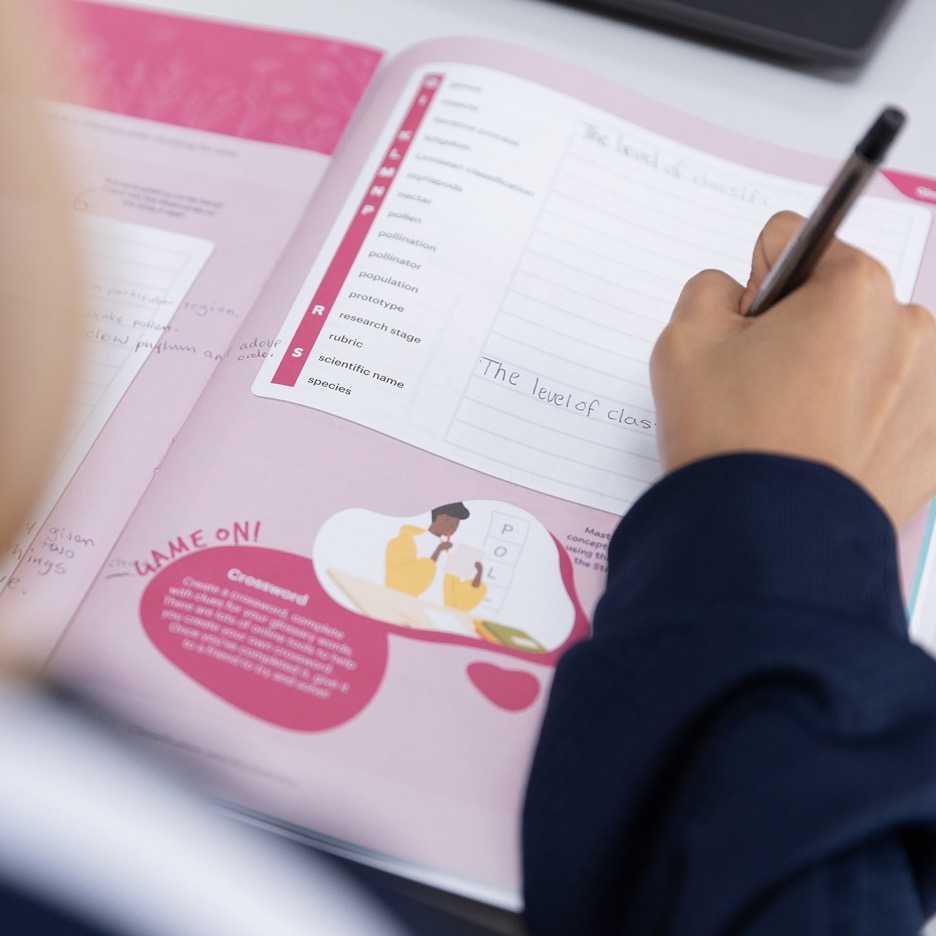 A student completing a printed Stile X revision workbook